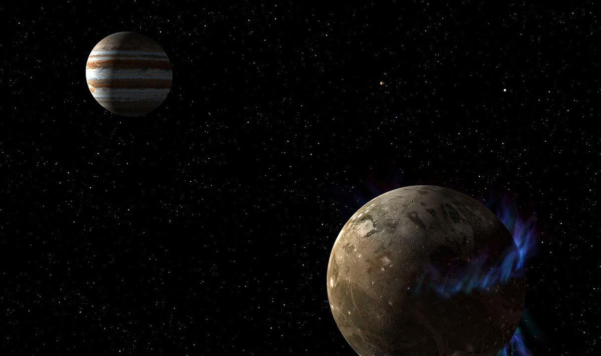 Kunstniku nägemus virmalistega Ganymedesest tiirlemas Jupiteri ümber. (Foto: Wikimedia Commons / NASA, ESA, G. Bacon (STScI))
