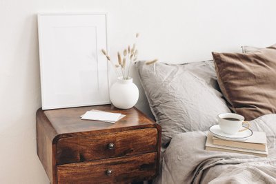 Portrait,White,Frame,Mockup,On,Retro,Wooden,Bedside,Table.,Modern