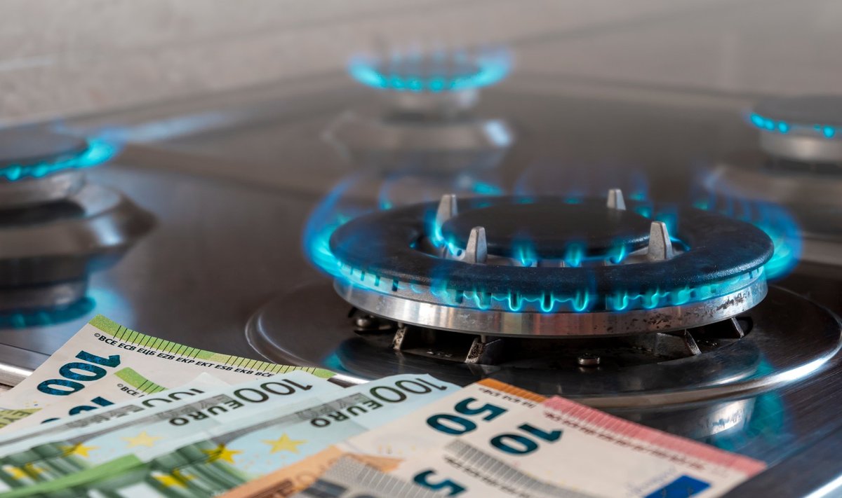 The,Banknotes,Lie,Next,To,A,Burning,Gas,Burner.,The