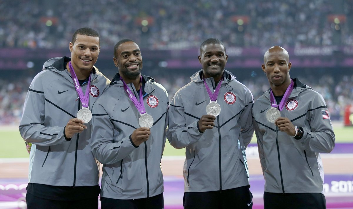 Silver medalists Kimmons, Gatlin, Gay and Bailey of the U.S. pose after receiving their medals for the men's 4x100m relay
