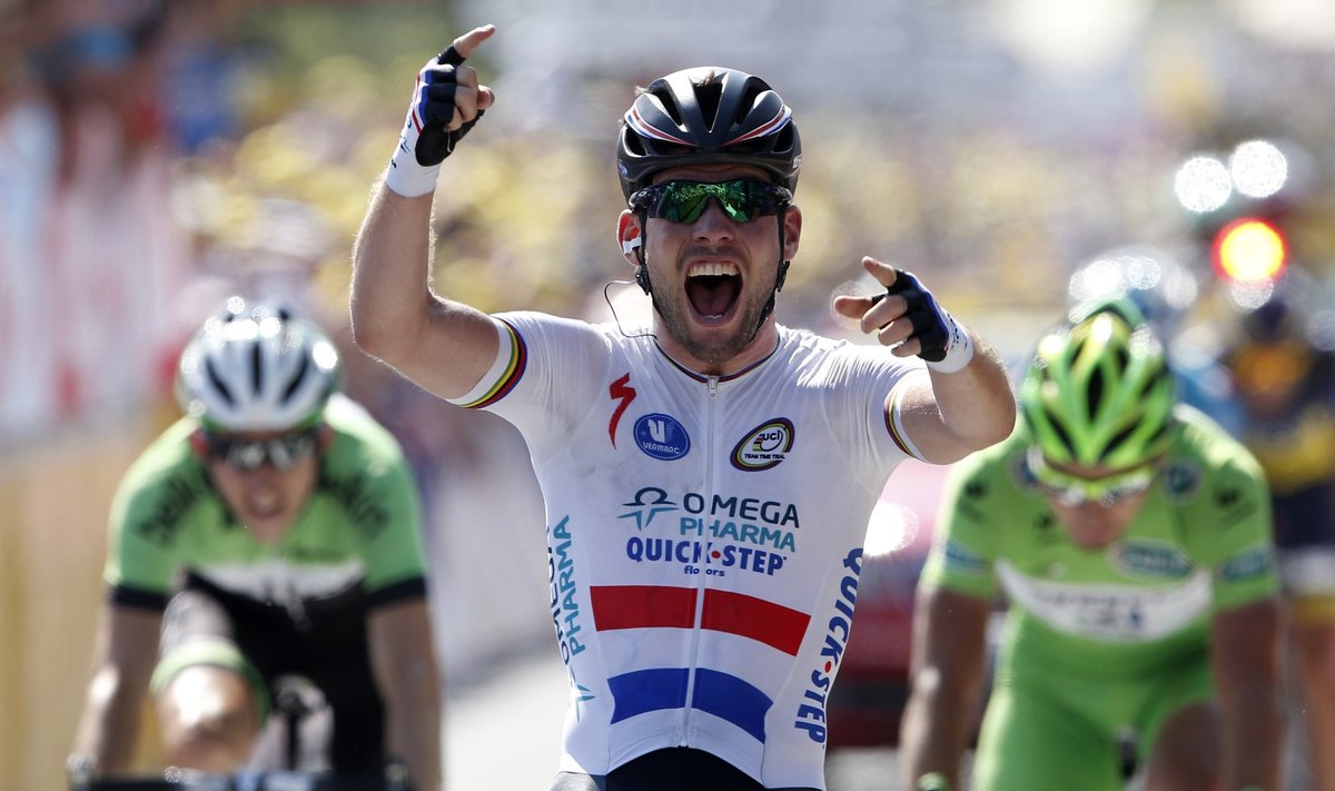 Omega Pharma-Quick Step team rider Cavendish of Britain celebrates as he crosses the finish line to win the thirteenth stage of the centenary Tour de France cycling race from Tours to Saint-Amand-Montrond
