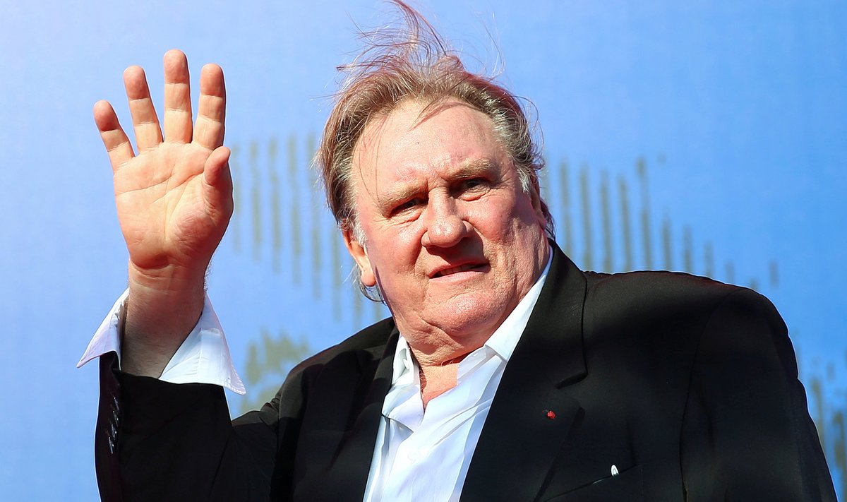 FILE PHOTO: Gerard Depardieu waves as he arrives during a red carpet event for the movie "Novecento- Atto Primo" at the 74th Venice Film Festival in Venice
