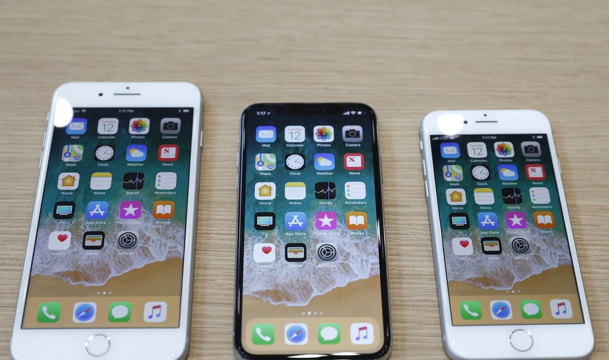 Different iPhone 8 models are displayed during an Apple launch event in Cupertino