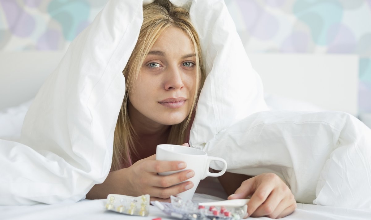 Portrait,Of,Young,Woman,With,Coffee,Mug,And,Medicines,Suffering