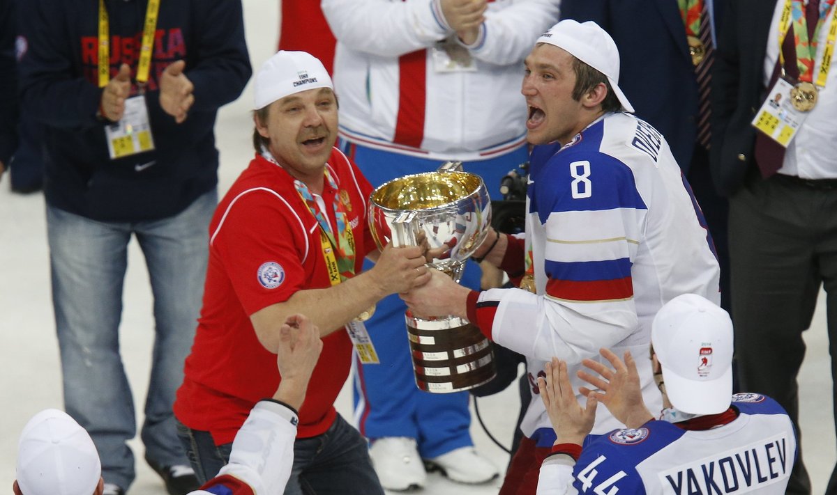 Russia's head coach Znarok and Ovechkin celebrate with the trophy after winning their men's ice hockey World Championship final game against Finland at Minsk Arena in Minsk