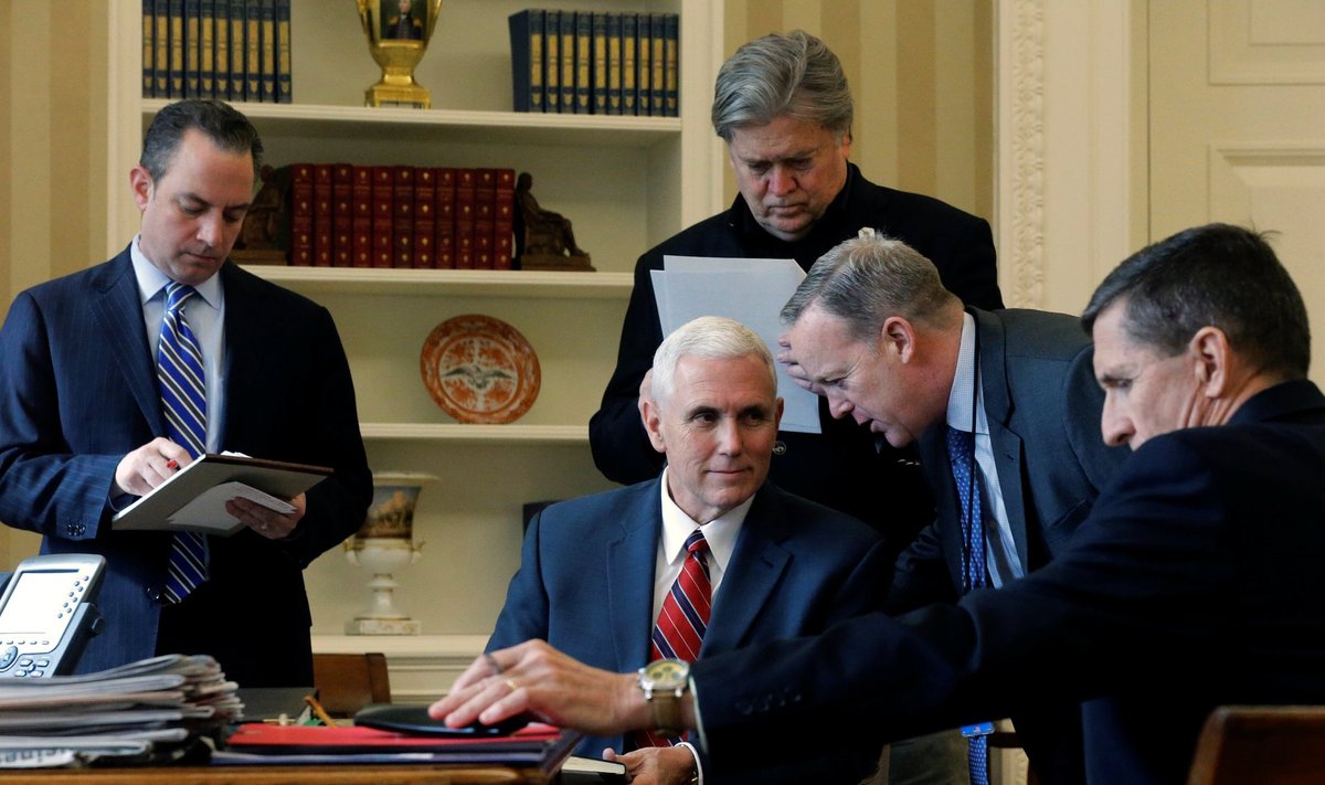 White House inner circle Priebus, Pence, Bannon, Spicer and Flynn attend as Trump speaks by phone with Putin in the Oval Office at the White House in Washington
