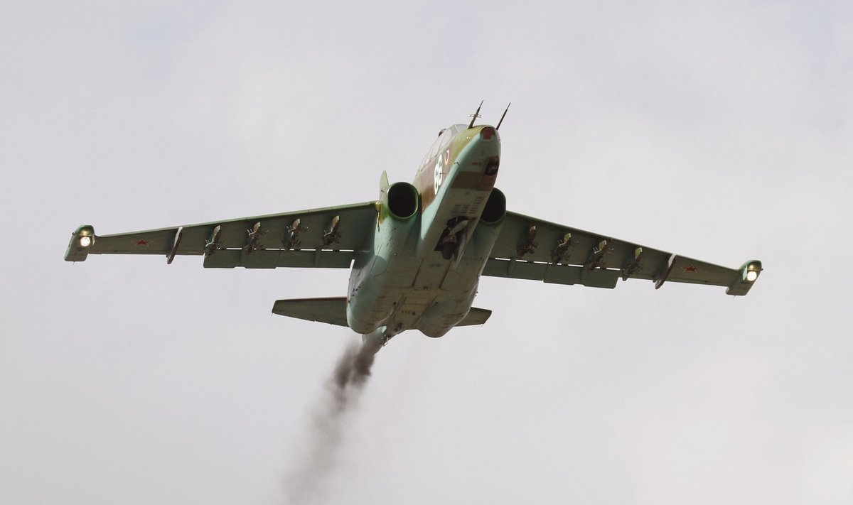 A Belarusian Sukhoi Su-25 jet fighter flies during a drill near the village of Pobednoe