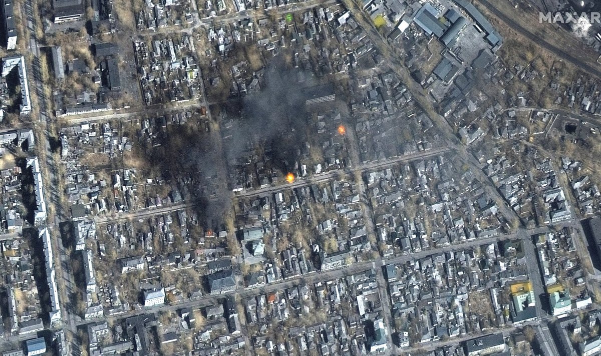 A satellite image shows a color infrared view of fires burning near Fontanna street, in eastern Mariupol