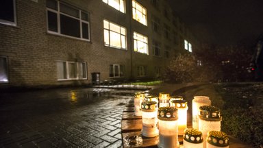 PHOTOS: people leave flowers, candles in front of the school