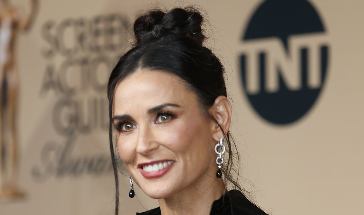 Presenter Demi Moore poses backstage at the 22nd Screen Actors Guild Awards in Los Angeles