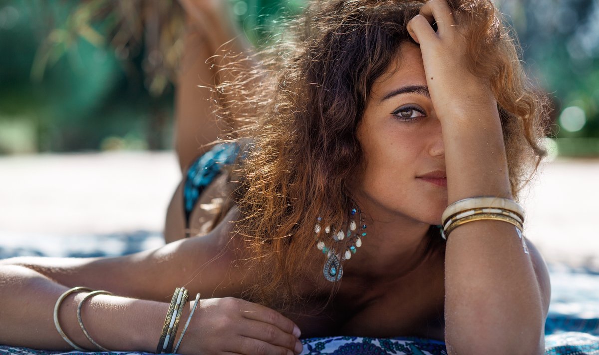 stylish boho woman on the beach