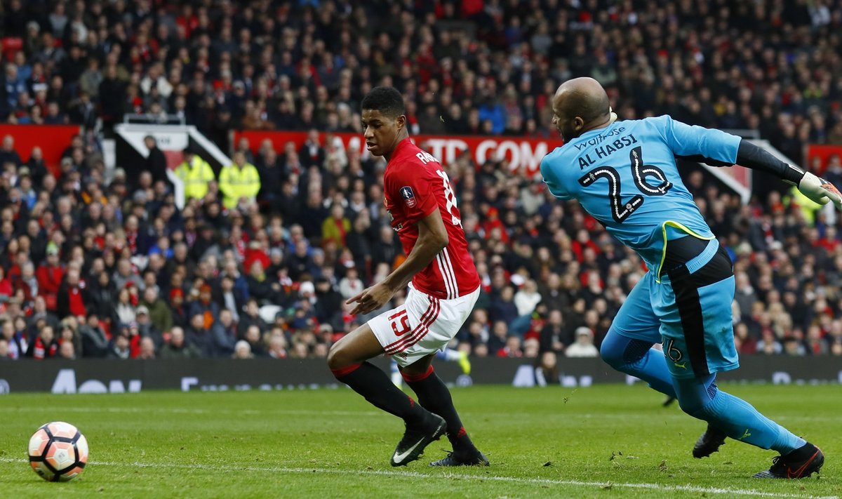 Manchester United's Marcus Rashford scores their fourth goal past Reading's Ali Al Habsi