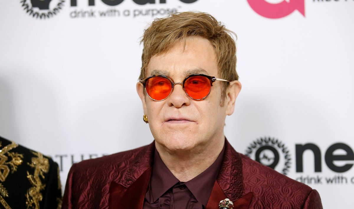 Singer Elton poses at his 70th Birthday and 50-Year Songwriting Partnership with Bernie Taupin benefiting the Elton John AIDS Foundation and the UCLA Hammer Museum at RED Studios Hollywood in Los Angeles